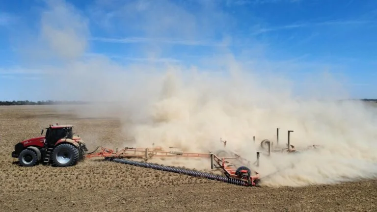 A BROOKFIELD ChainBar working a paddock behind a tractor